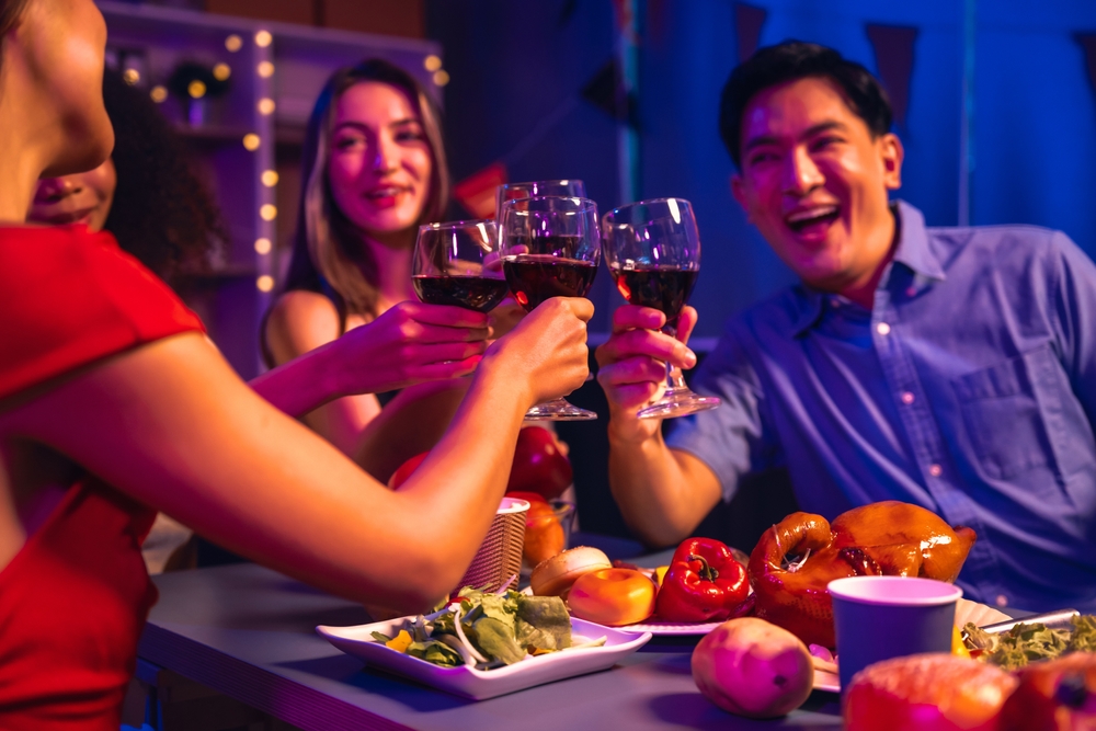 A group of men and women drinking alcohol at office parties.