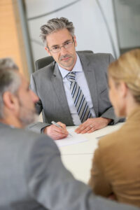 mature couple having a free consultation with an attorney