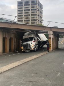 truck jammed under a bridge 225x300 1