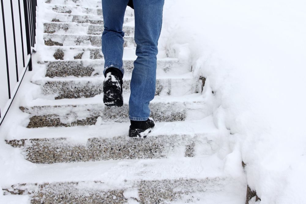 Risk,Of,Slipping,When,Climbing,Stairs,In,Winter.,A,Man